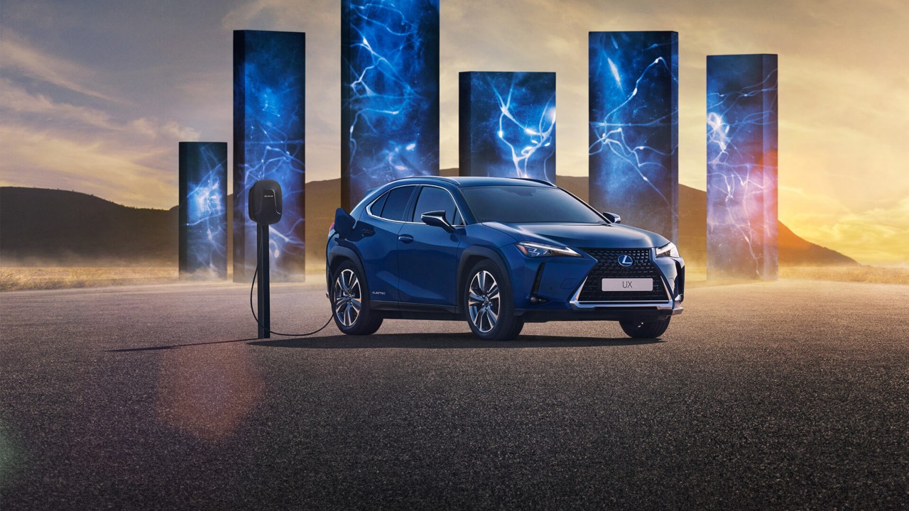 Lexus UX 300e plugged into a charging tower