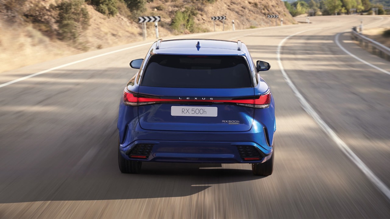 Rear view of a Lexus RX 500h driving