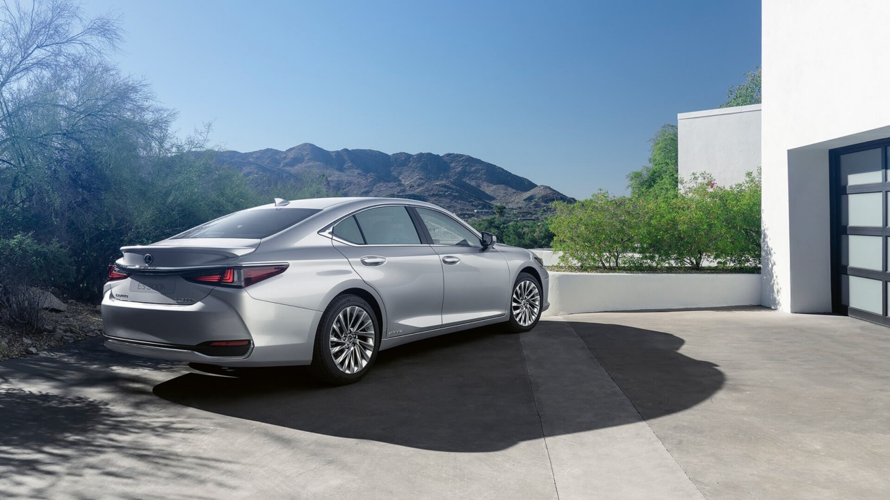 Lexus ES 300h parked outside a house 