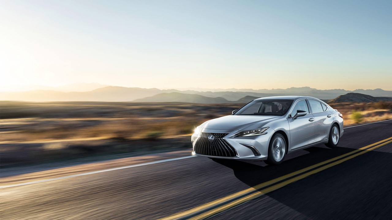 Lexus ES driving through a desert location 