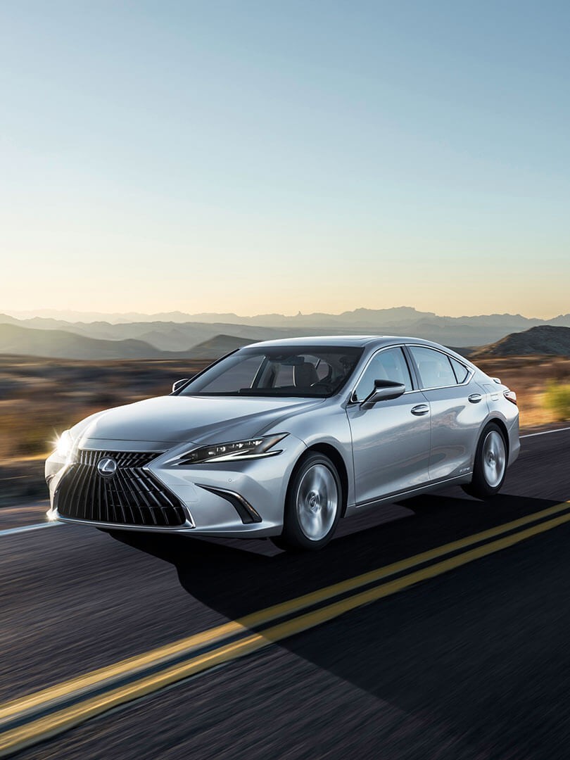 Lexus ES driving through a desert location 