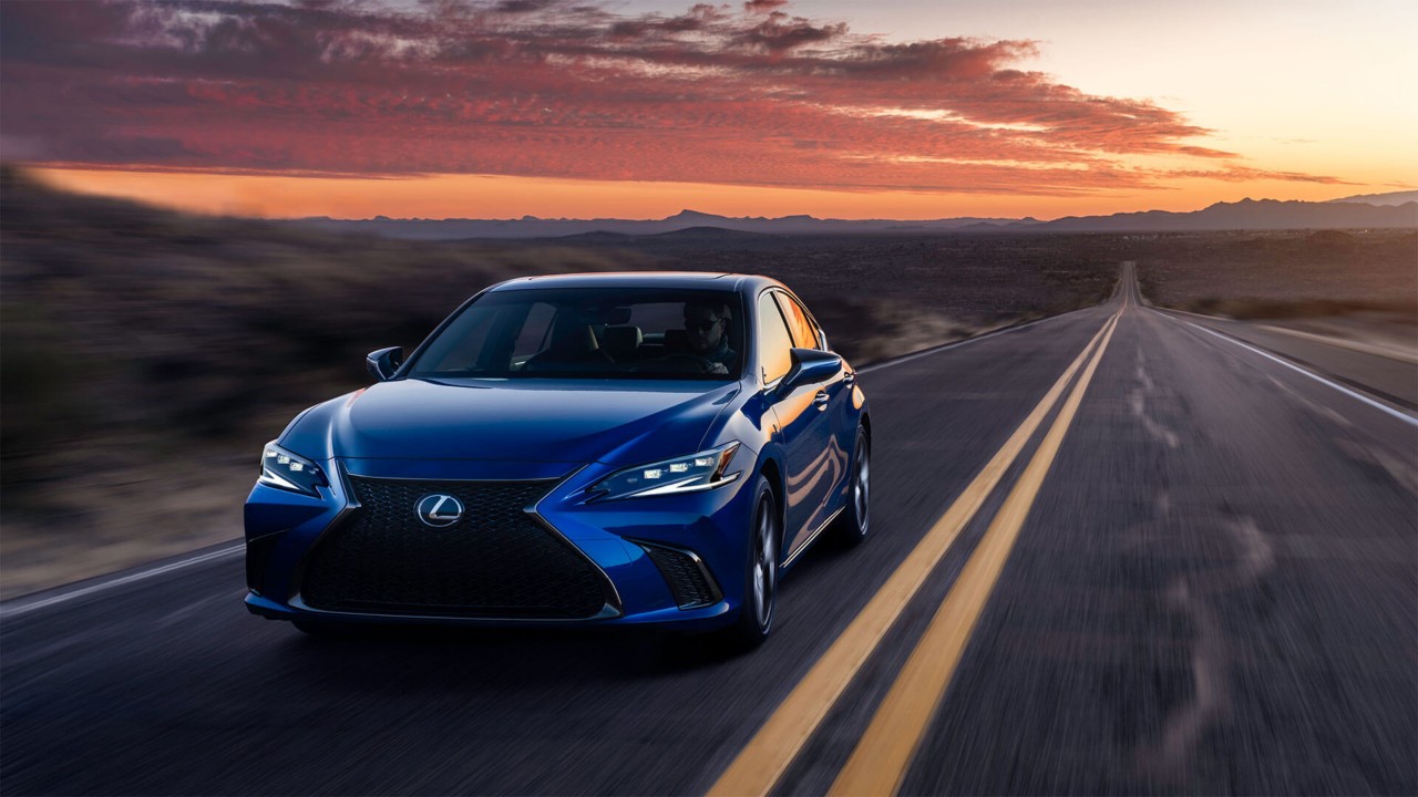 Lexus ES driving through a rural location 