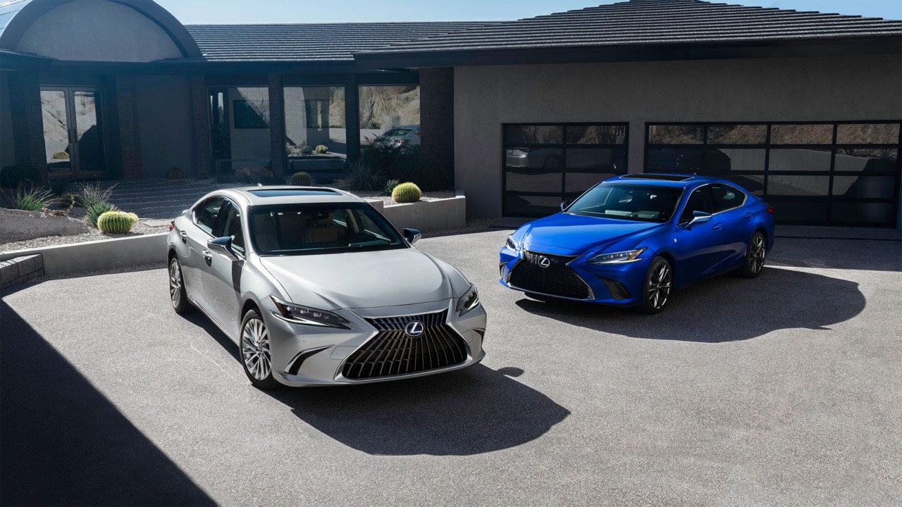 Two Lexus ES's parked outside a house 