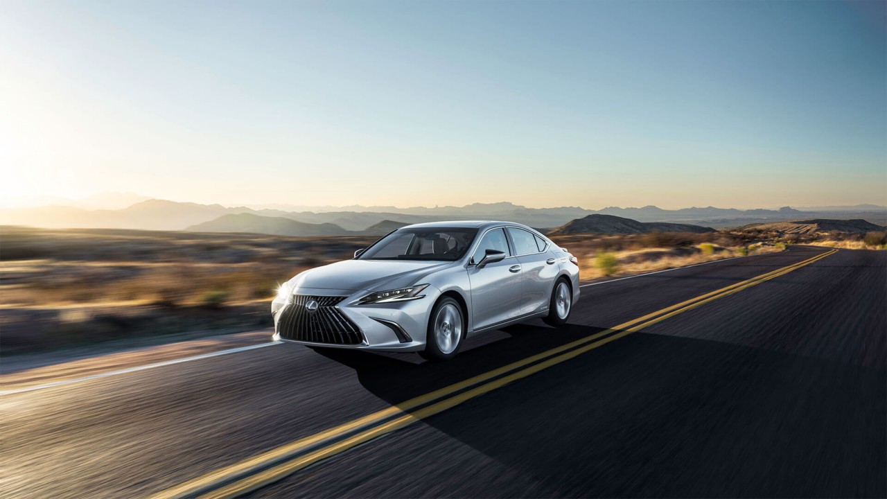 Lexus ES driving through a desert location 