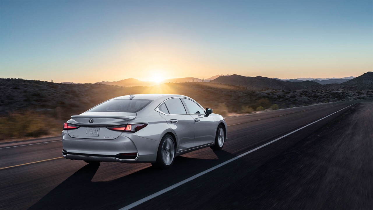 Lexus ES driving through a desert location 