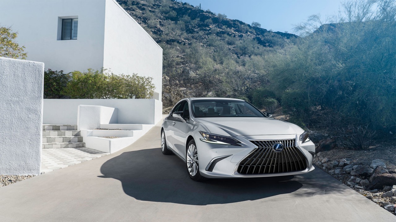 Lexus ES parked outside a house 