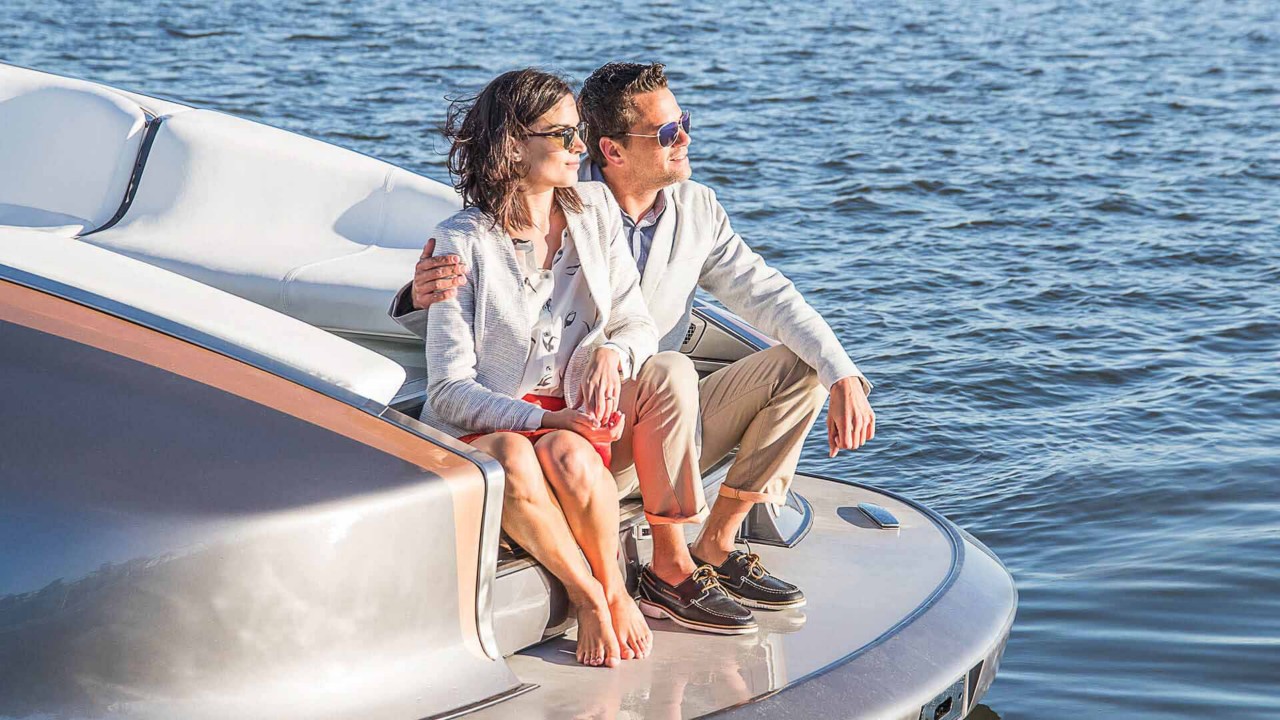 A man and woman sat on the Lexus Sports Yacht 