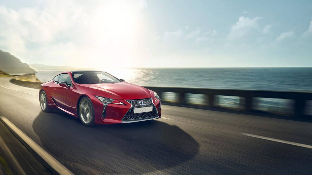 Lexus LC driving on a coastal road 