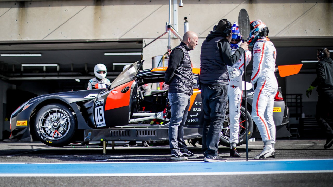 Lexus drivers surrounding the Lexus RC F motorsport race car 