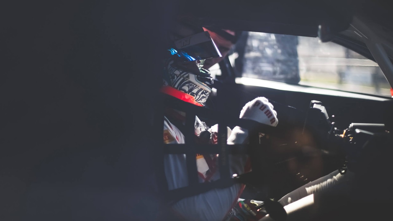 A driver inside a Lexus RC F motorsport 
